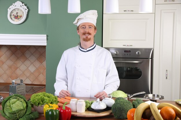 Young chef preparing lunch in kitchen