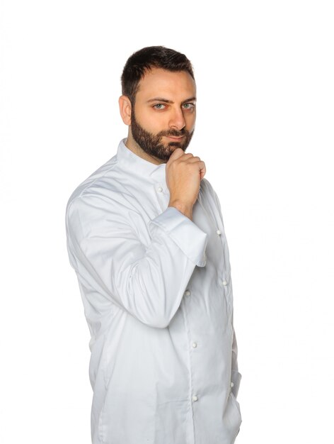 Young chef on white background.