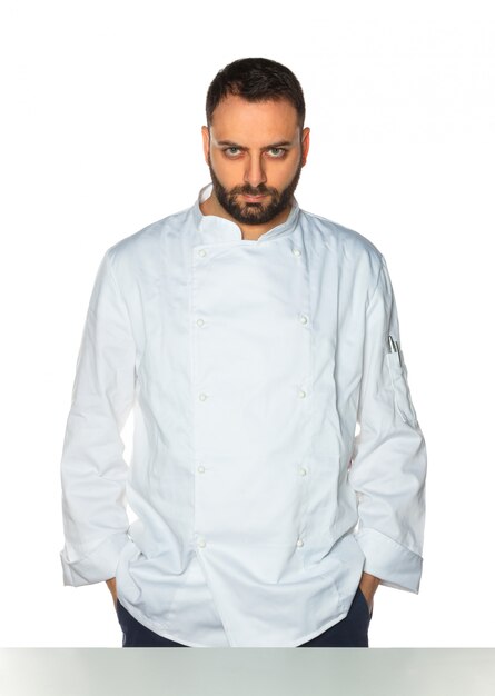 Young chef on white background.