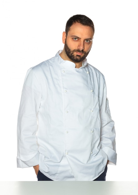 Young chef on white background.