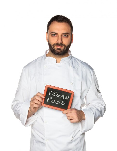 Young chef with chalkboard.