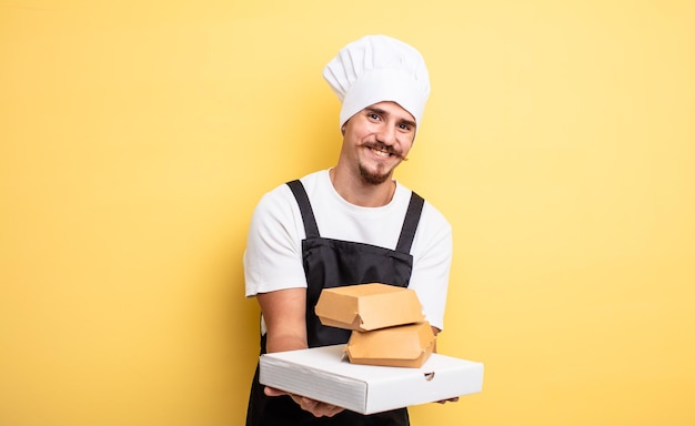 Young chef with moustache with take away fast food