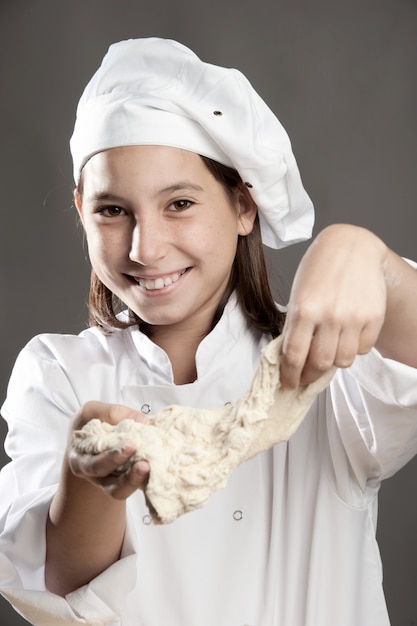 young chef working the dough