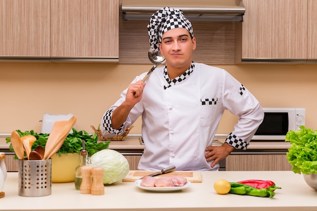 Young chef working in the kitchen