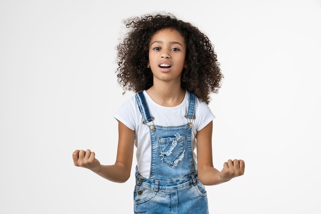 Young child girl angry and mad standing over isolated white background