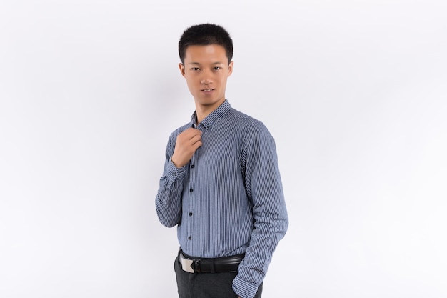 Young chinese business male in front of white background