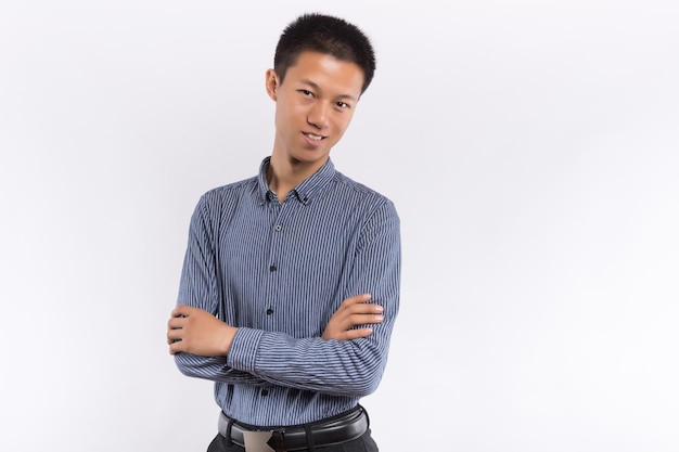 Young Chinese business male in front of white background