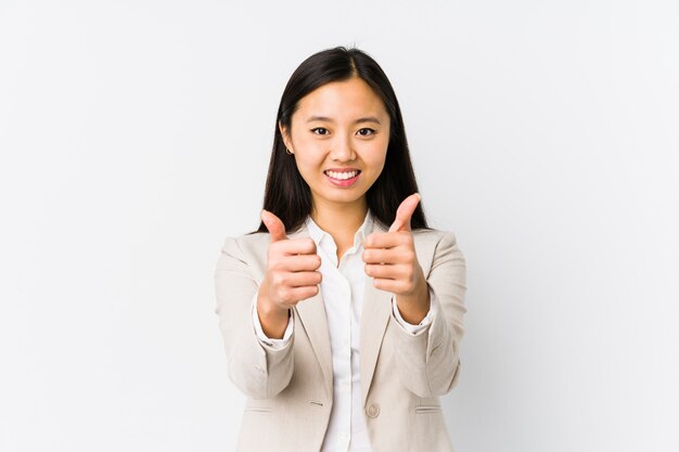 Young chinese business woman isolated with thumbs ups, cheers about something, support and respect concept.
