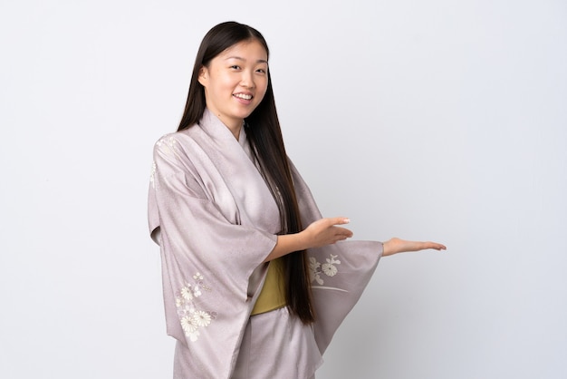 Young Chinese girl wearing kimono isolated