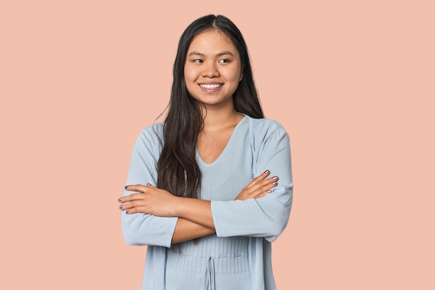 Young chinese woman isolated smiling confident with crossed arms