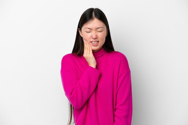 Young Chinese woman isolated on white background with toothache