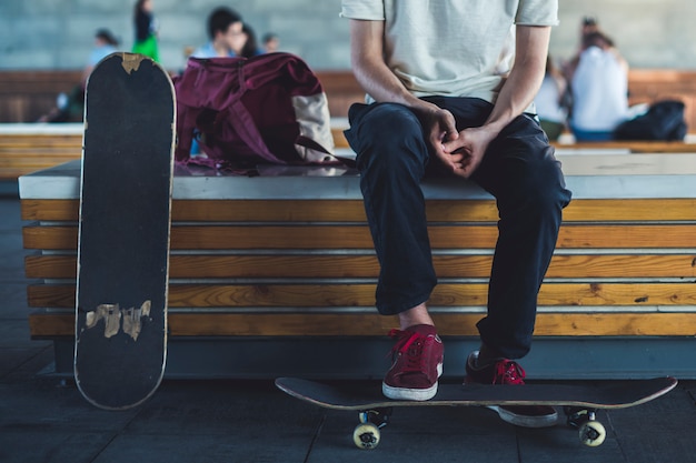 young classic skateboard rider close chilling in the street lifestyle.