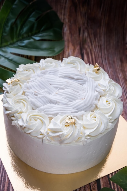 Young coconut cake with wooden texture background