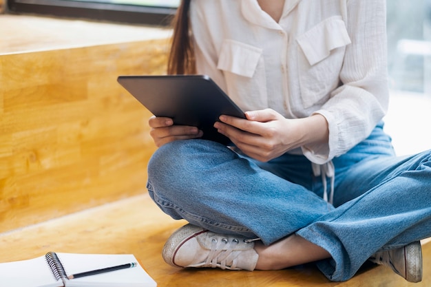 Young collage student using computer and mobile device studying online. education and online learning.