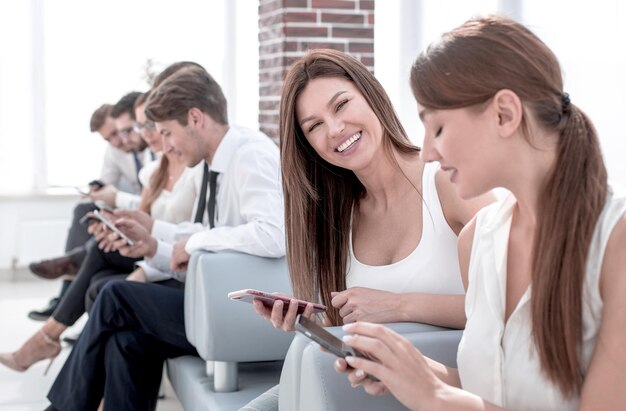 Young colleagues sitting in the office hallway