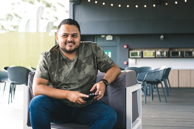 Young Colombian sitting in a shopping mall, sharing a moment.