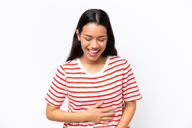 Young Colombian woman isolated on white background smiling a lot