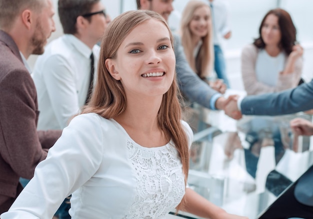 Young company employee standing in business office