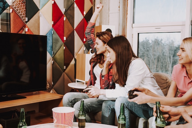 Young Company Playing Video Games On A Party