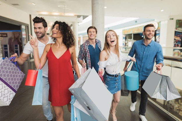 Young Company Shopping At The Mall. Black Friday.