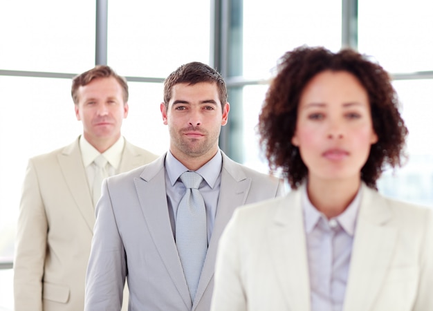 Photo young confident businessman with his team