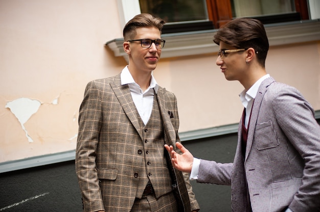 Young confident man in formal clothes outdoor in the cit