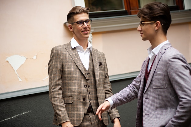 Young confident man in formal clothes outdoor in the cit