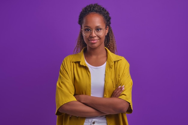 Young confident successful african american woman arms crossed looks at camera