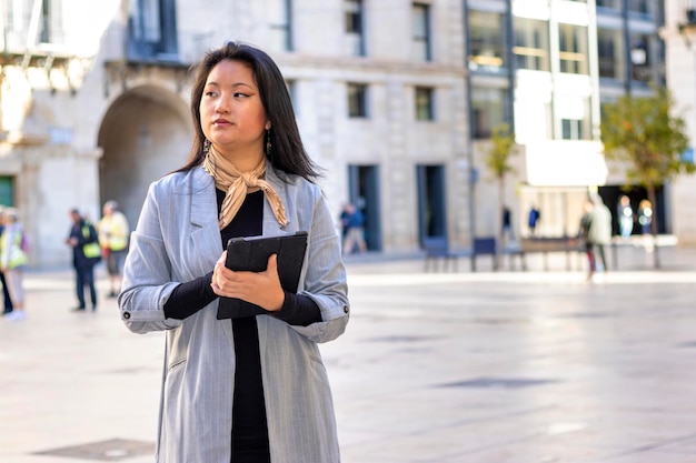 Young confident successful Asian business woman professional entrepreneur office employee