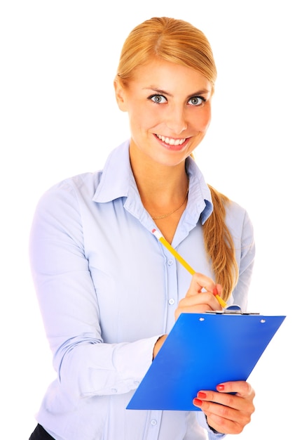 a young confident woman standing over white background and writing