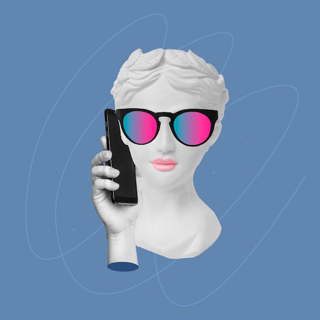 Young confident woman in sunglasses headed by antique statue head talking on the mobile phone