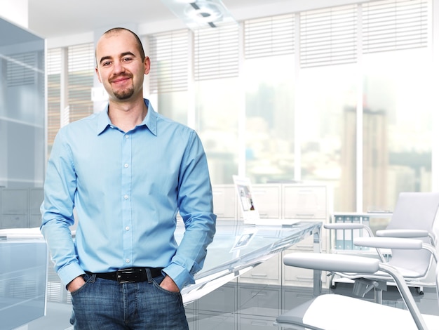 Young confident worker standing in 3d office