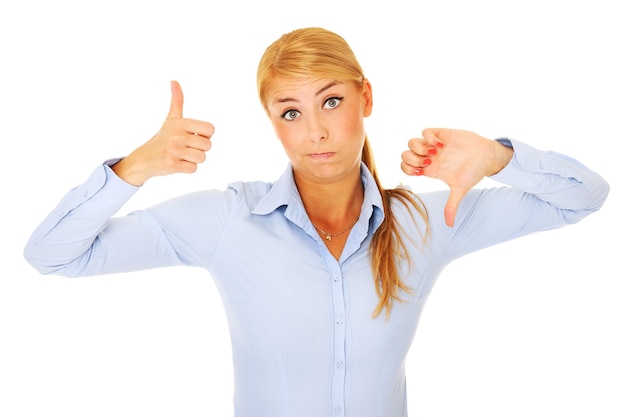 Photo a young confused woman over white background