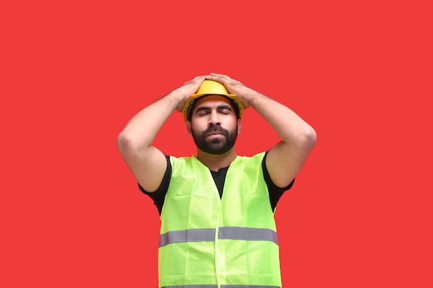 Young construction worker feeling tired and hands on halmet\
indian pakistani model