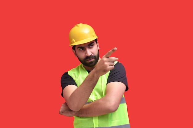 young construction worker pointing right indian pakistani model