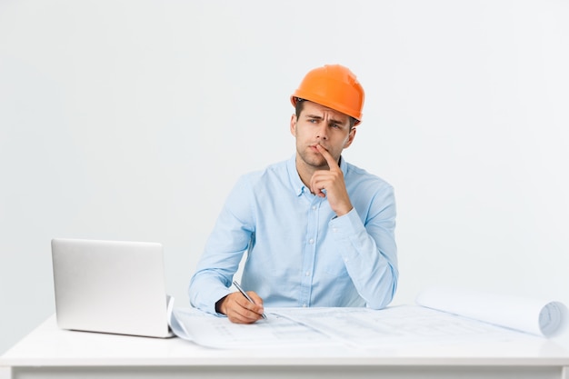 Young construction worker with expression