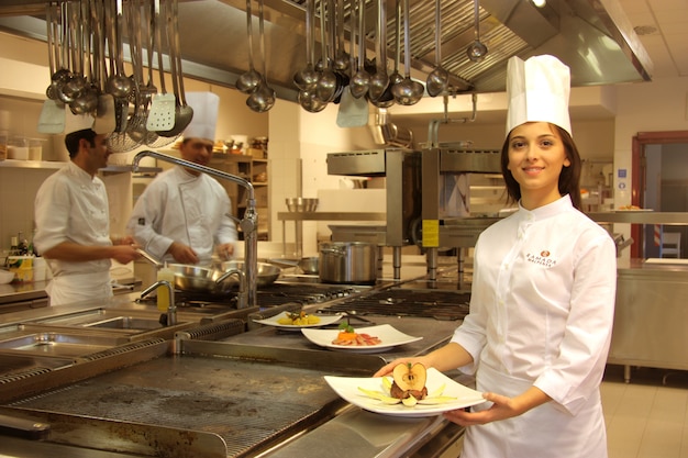 Young cook in a kitchen of a restaurant