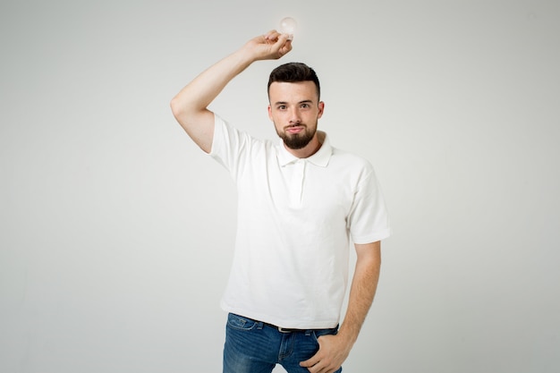 Young cool bearded man idea concept, happy  student coming up with an  or solution. isolated on white