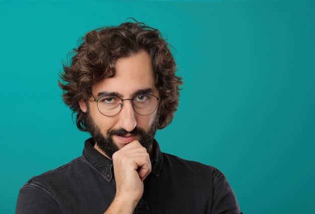 Young cool bearded man posing