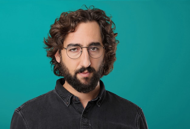 Young cool bearded man posing