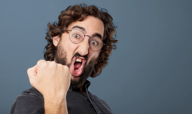 Young cool bearded man posing