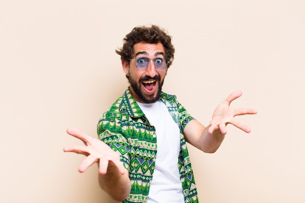 Young cool bearded man welcoming gesture
