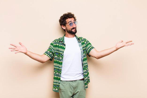 Young cool bearded man welcoming gesture