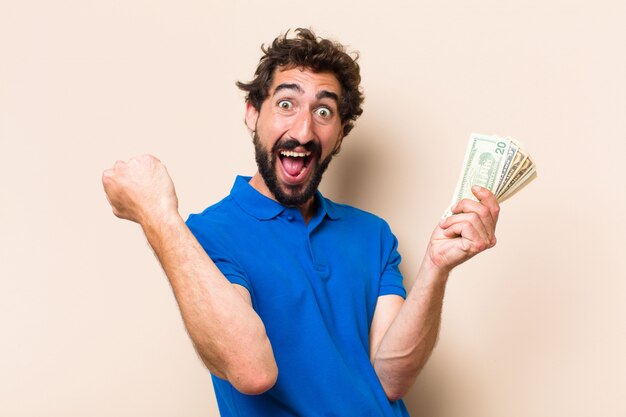 Young cool bearded man with dolar banknotes