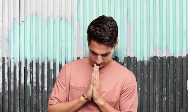 Young cool man against grunge background