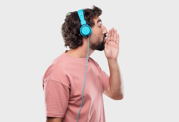 Young cool man expressing with headphones