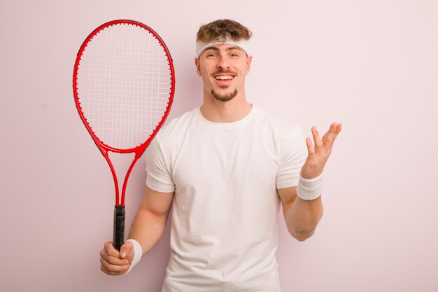 Young cool man feeling happy surprised realizing a solution or idea tennis concept