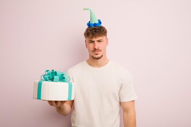 Young cool man feeling sad upset or angry and looking to the side birthday concept