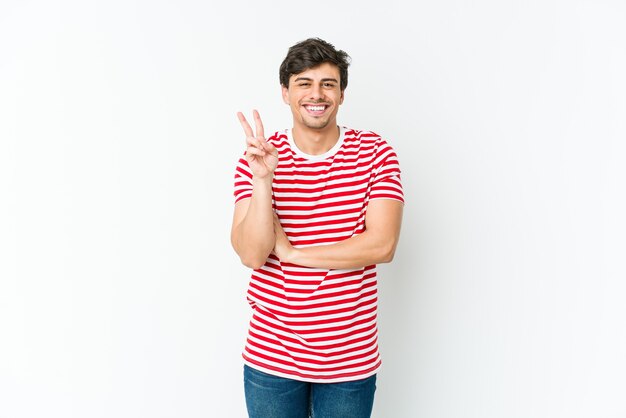 Young cool man showing number two with fingers