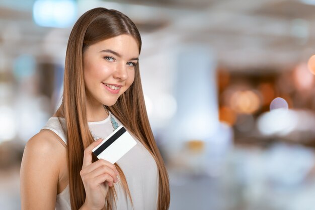 Young cool woman with credit card